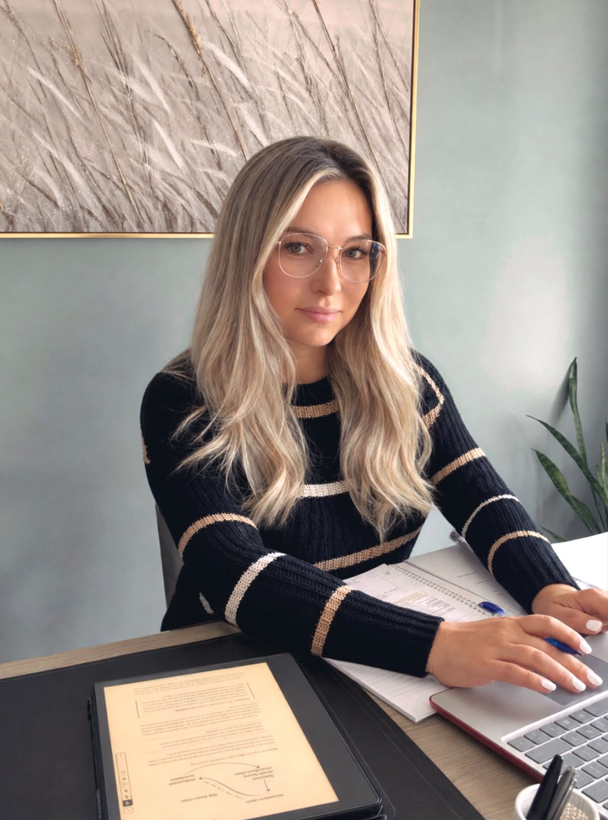 Karina Sinchenko working at her desk